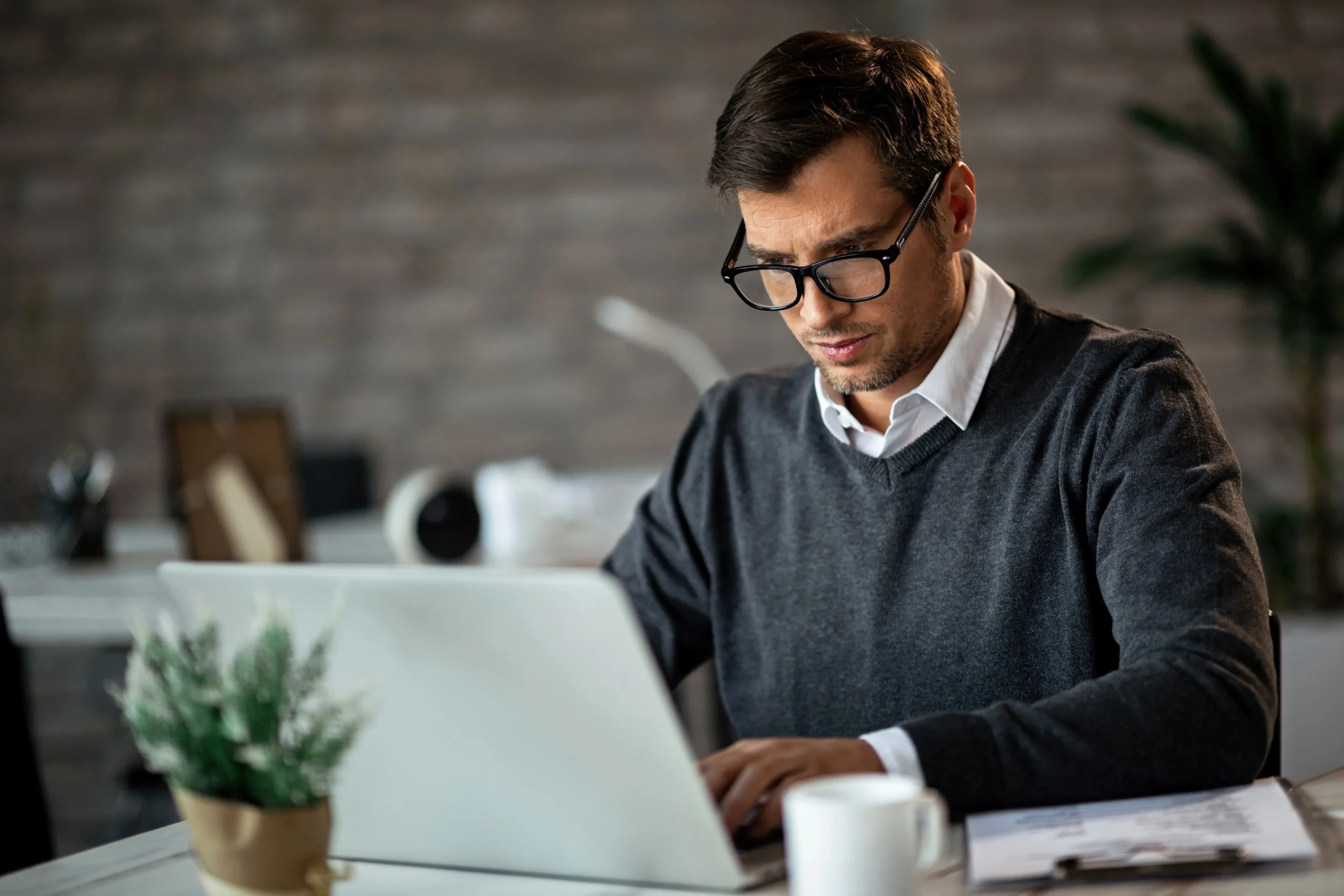Professional Using Laptop With Ttgi Connectivity Solutions On A Taas Platform