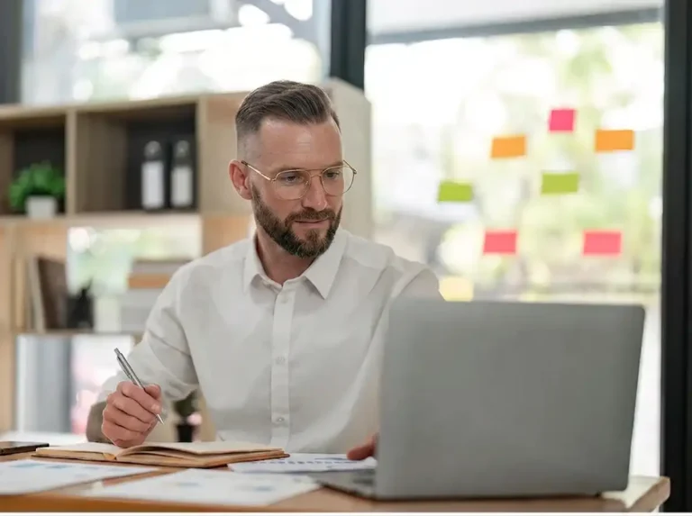 Investor Relations Ttgi Company Information.image.investor Reviewing Ttgi Investor Relations Information On A Laptop